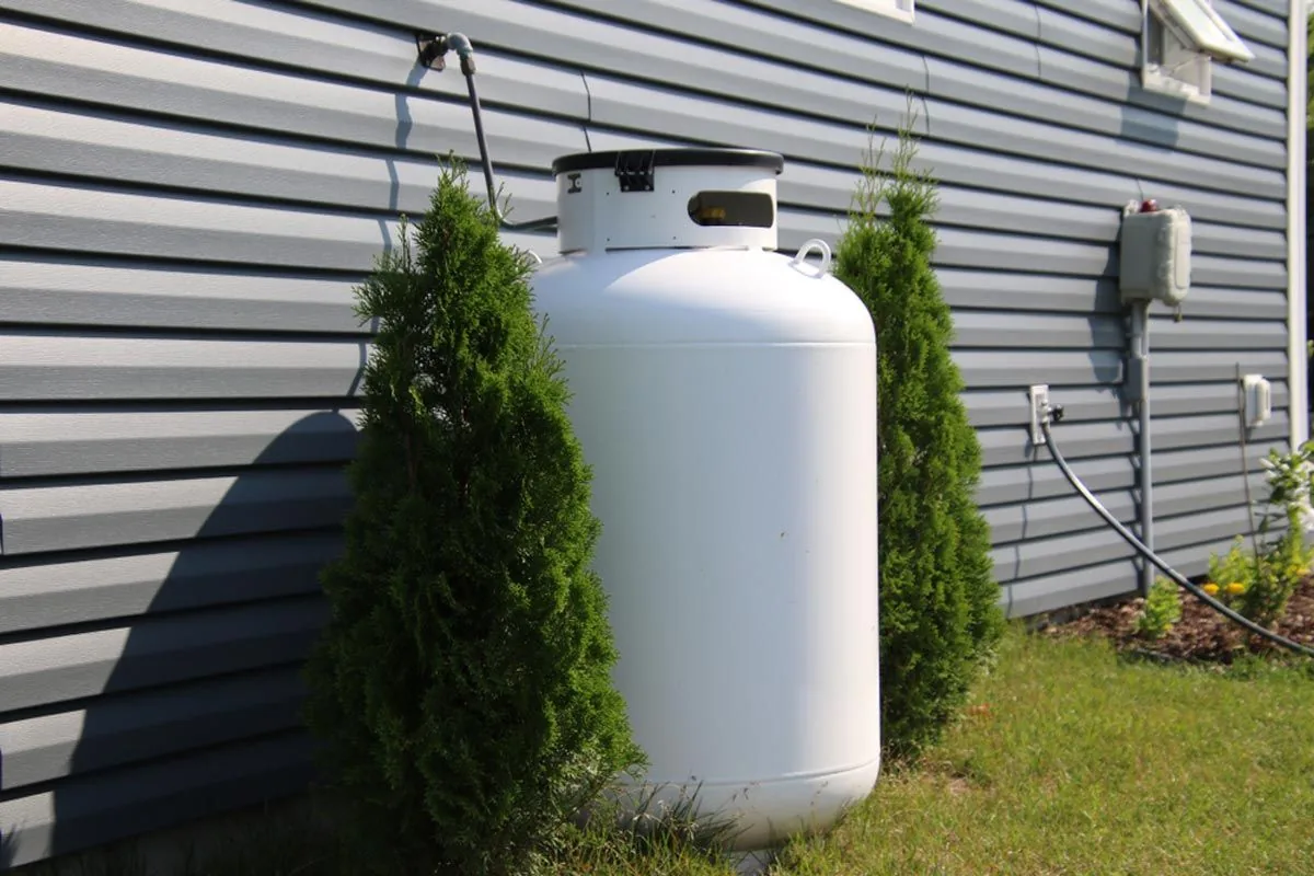 Residential propane tank installed beside a home