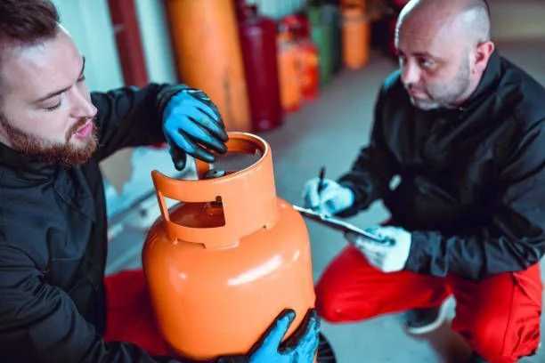 Get Propane Refill team reviewing propane cylinder service equipment