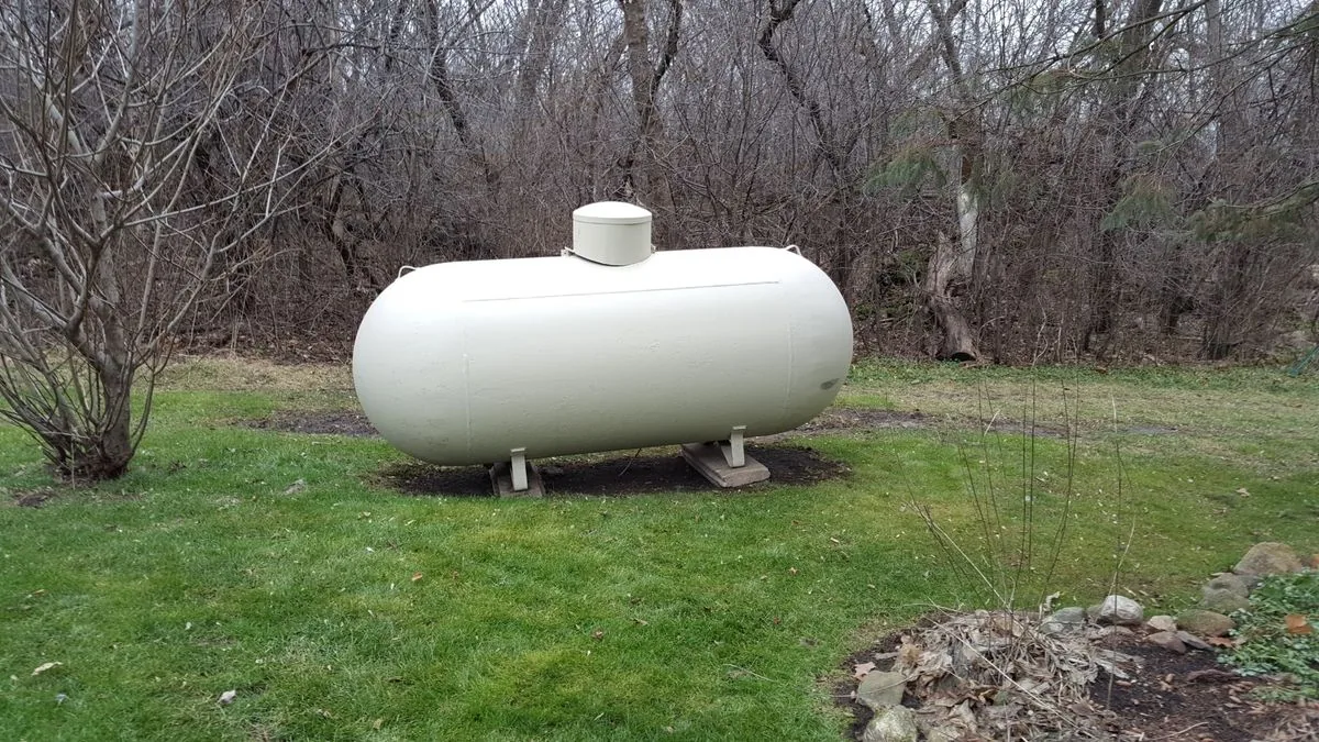 Propane storage tank at a service location used as a Get Propane Refill disclaimer banner
