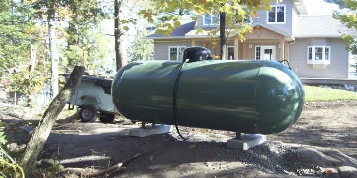 Residential propane tank installed beside a home