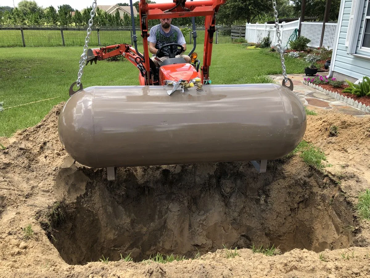 Propane tank being positioned during property development