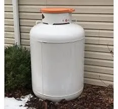 Residential propane tank near a landscaped yard