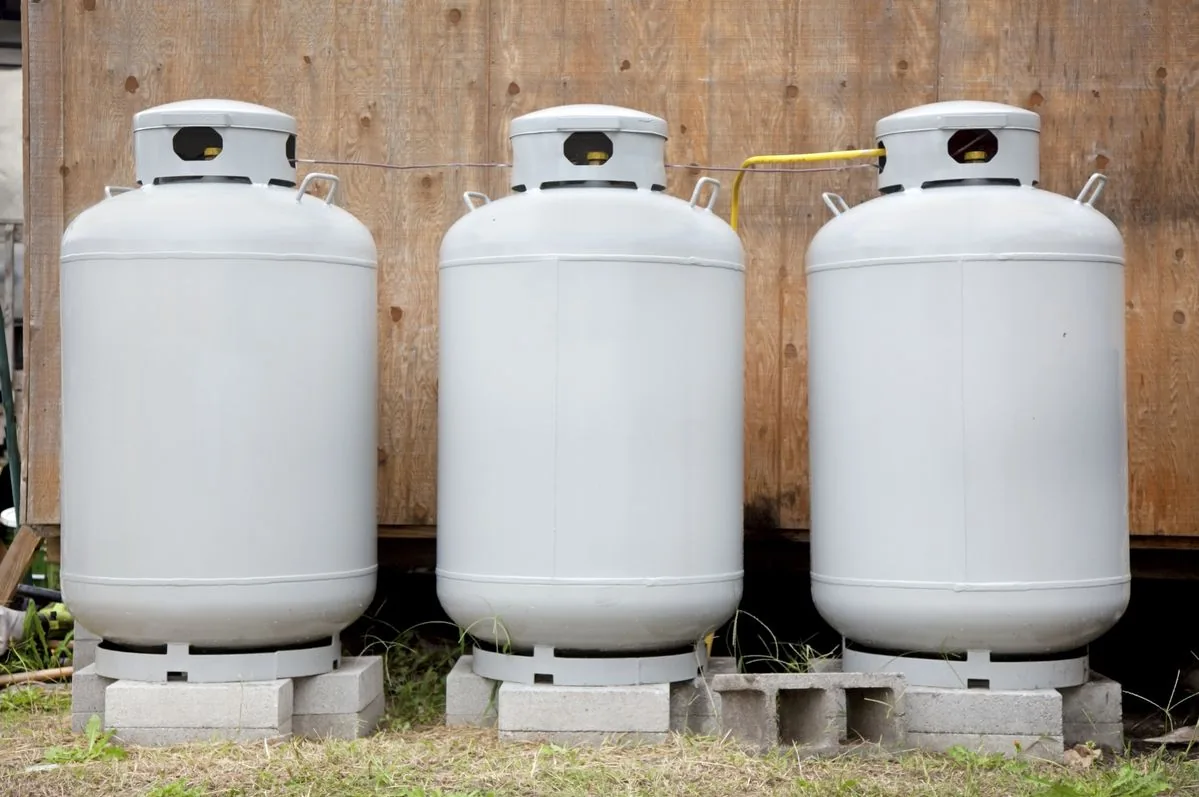 Three residential propane tanks positioned outdoors
